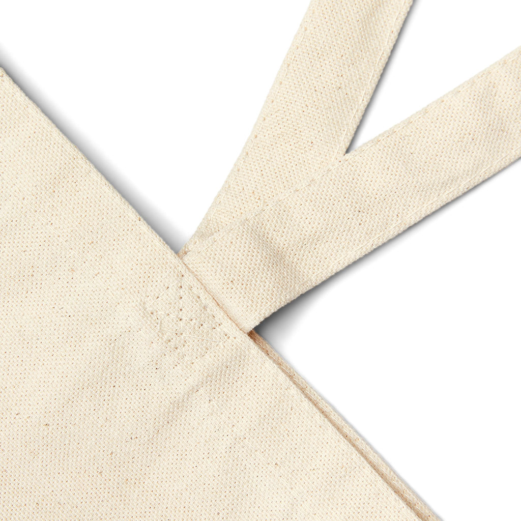 Tote bag en toile naturelle, couture et empiècement des anses