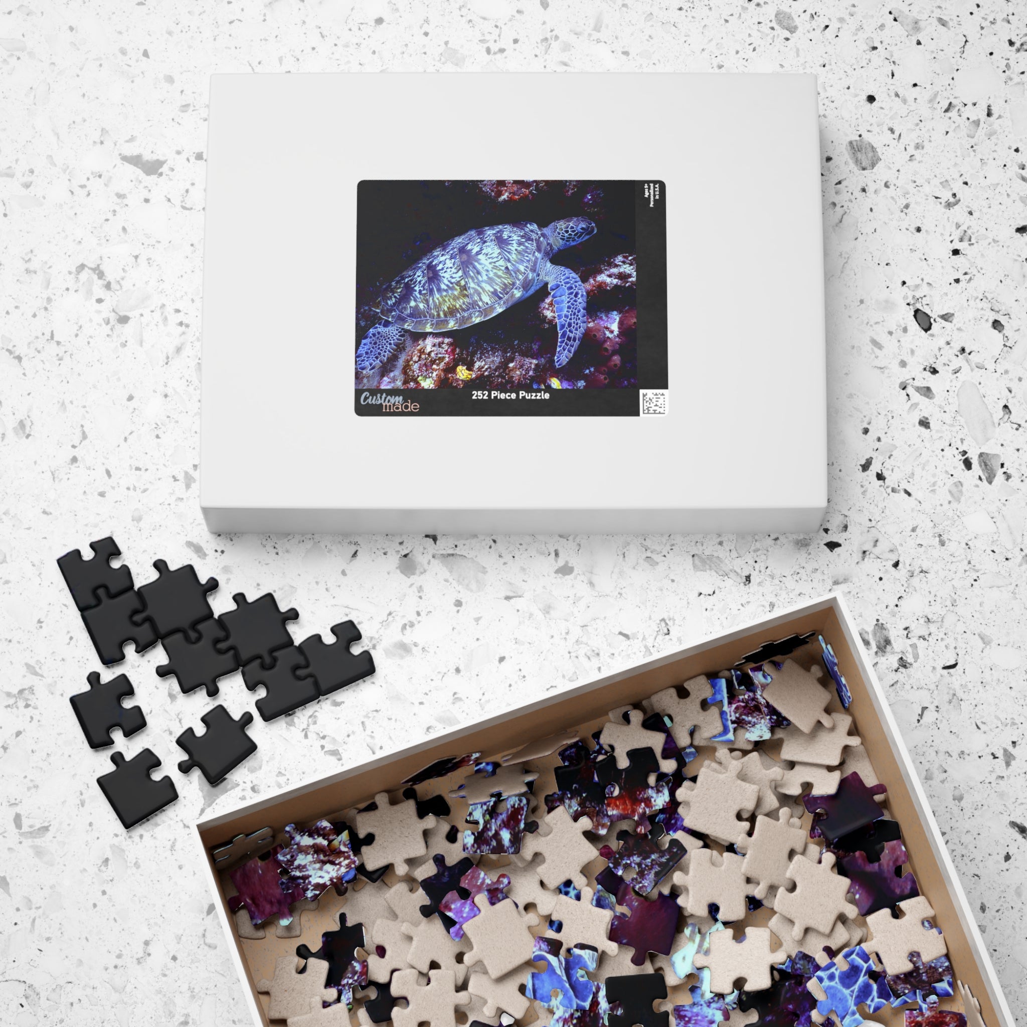 Boîte de puzzle tortue marine avec motif sous-marin et pièces noires