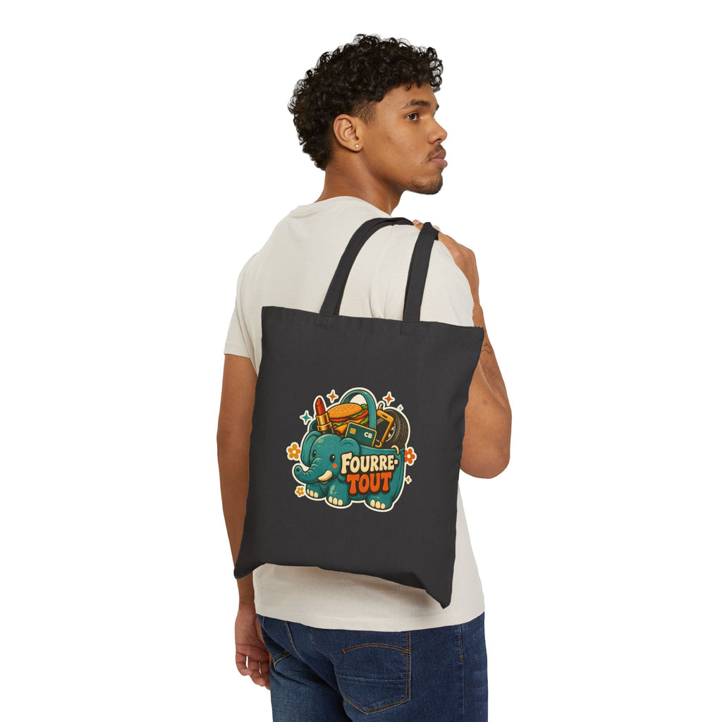 Tote bag en toile noire avec motif éléphant Fourre TOUT, porté sur l’épaule