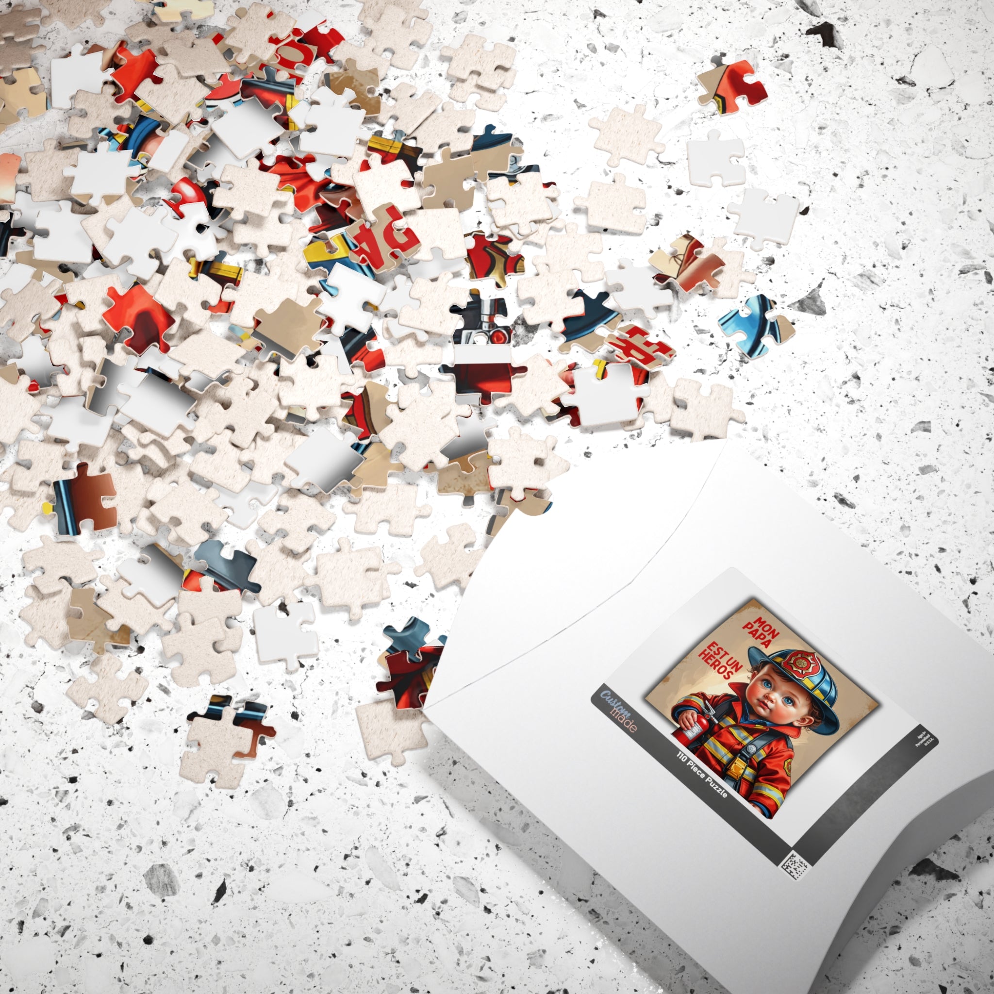 Boîte de puzzle blanche et pièces éparpillées, visuel « Mon papa est un héros »
