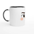Mug en céramique blanc avec poignée noire et visage kawaii grognon