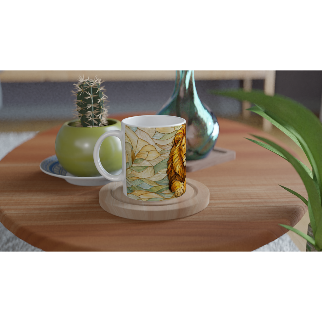 Mug en céramique blanc illustré d’un lion doré parmi des feuilles