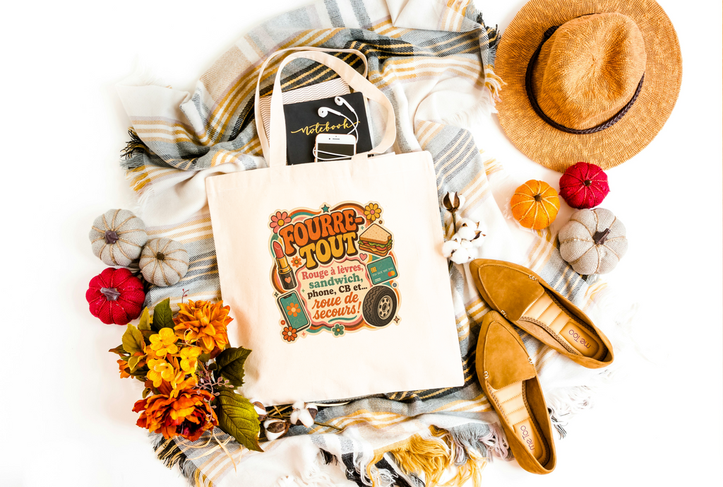 Sac fourre-tout en toile naturel avec imprimé 'Fourre Tout' coloré, anses longues.
