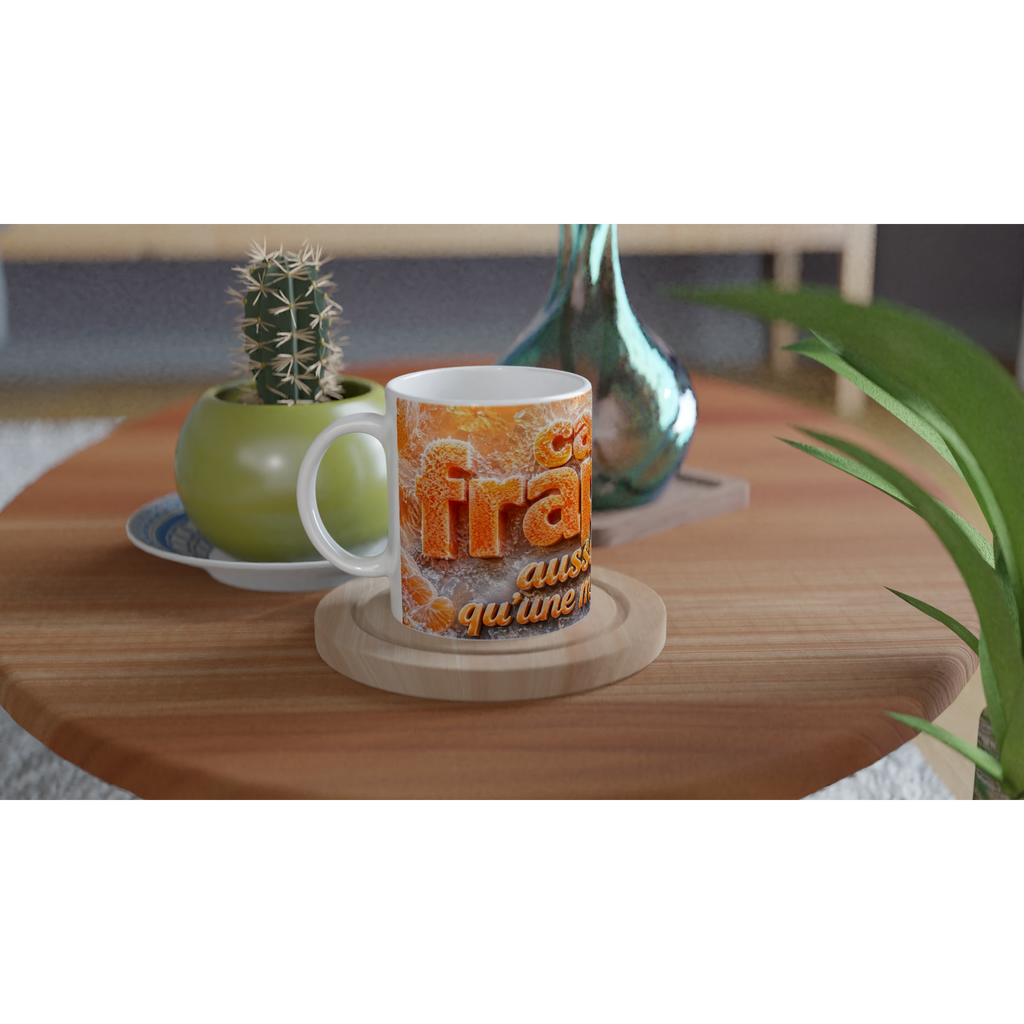 Mug blanc avec impression orange texture givrée, texte « Tra... » et « qu’une »