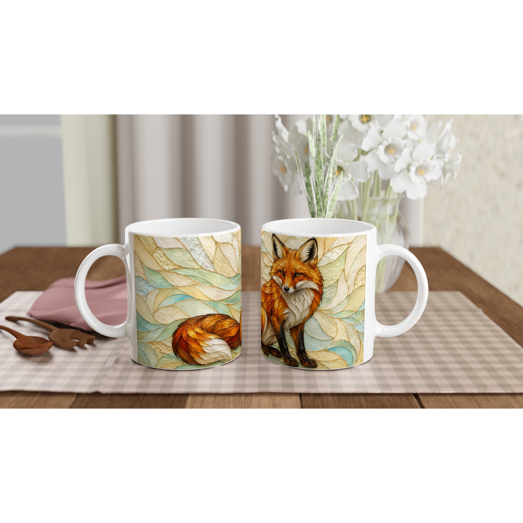 Deux mugs en céramique blancs avec renard roux et feuilles, poignées visibles
