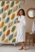 Rideau de douche tissu crème, motif feuilles rétro multicolores, œillets pour tringle.