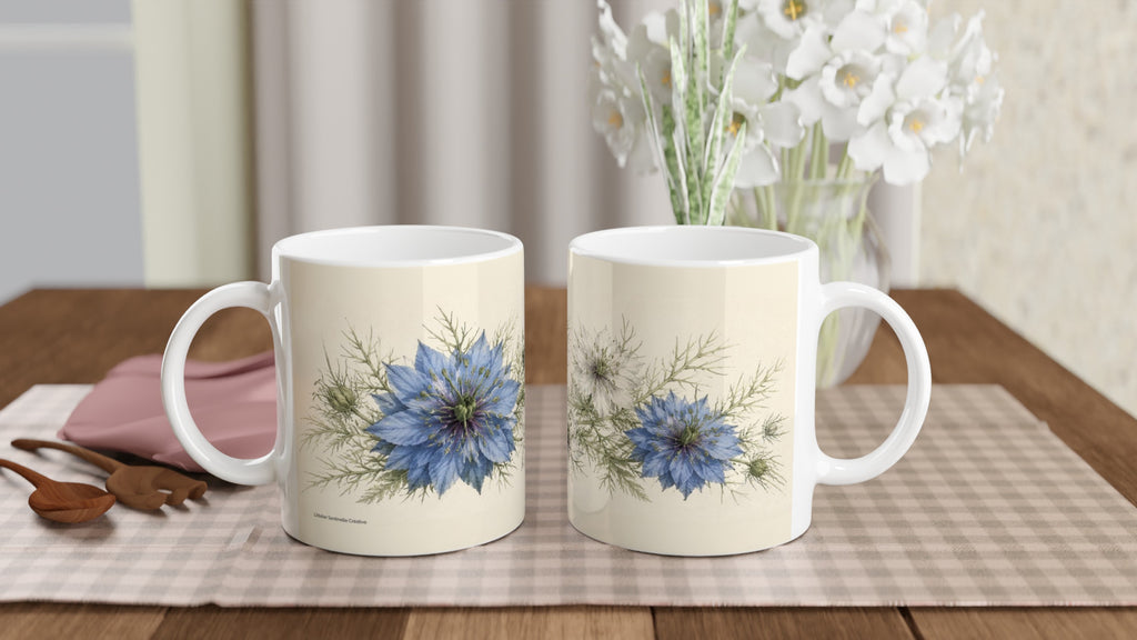 Lot de 2 mugs blancs à motif de nigelle bleue, anses blanches.